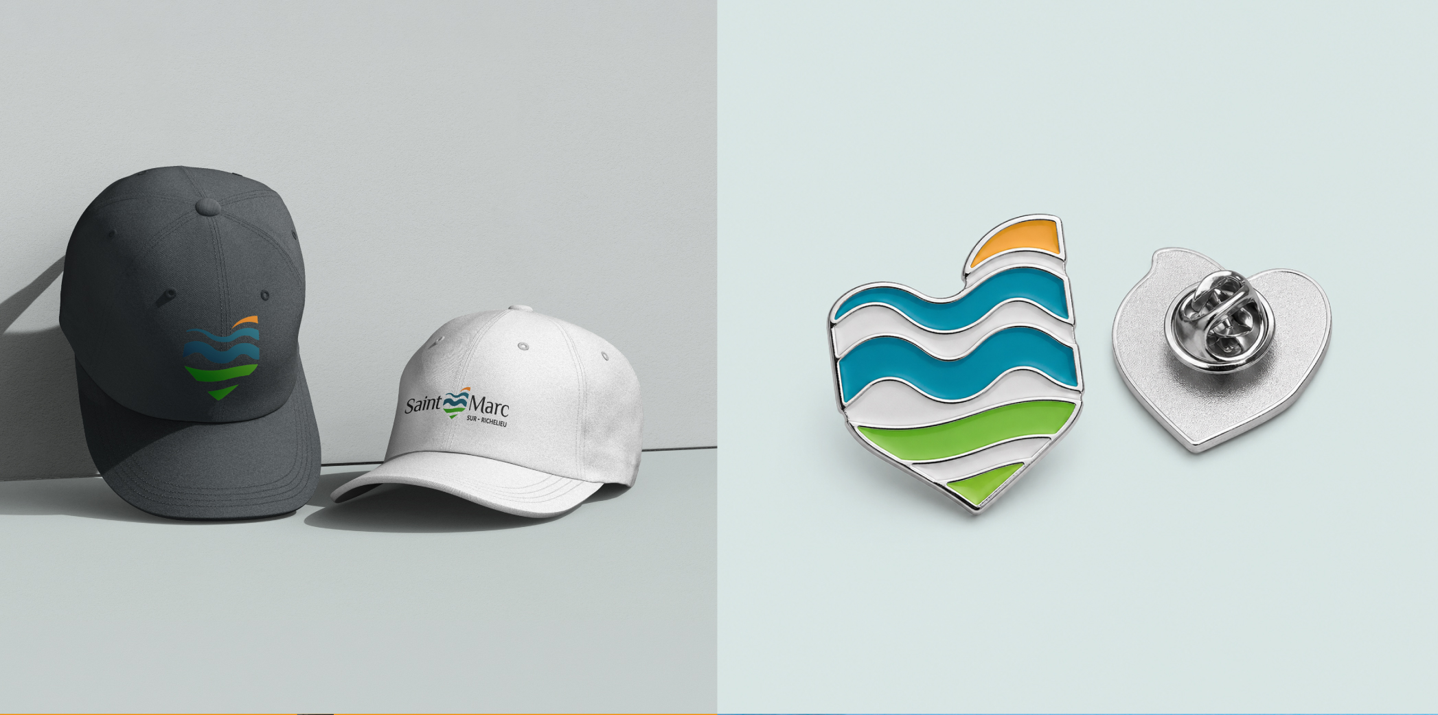 Split image: left side shows two baseball caps on a gray surface, a dark cap with a blue–green wave logo and an orange accent and a white cap with 'Saint Marc' text; right side displays two enamel pins—a turquoise wave-shaped heart and a separate silver heart pin.