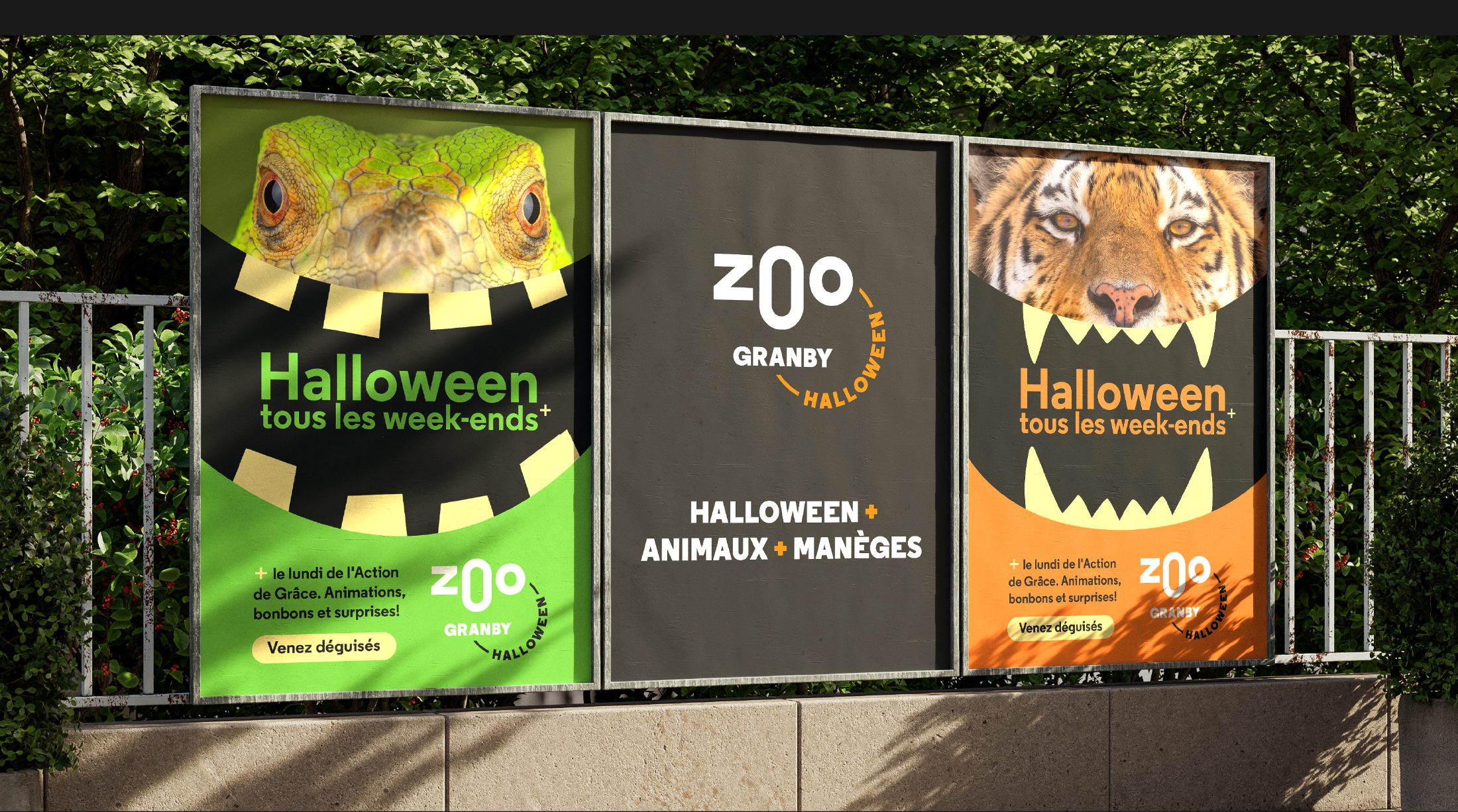 Three zoo Halloween posters on a fence: green lizard-face poster, dark gray center poster with 'zoo' graphic, and orange tiger-face poster, all advertising Halloween events.